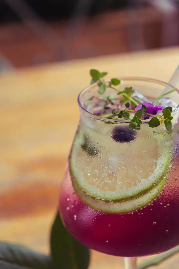 Purple citrus cooler with lime.